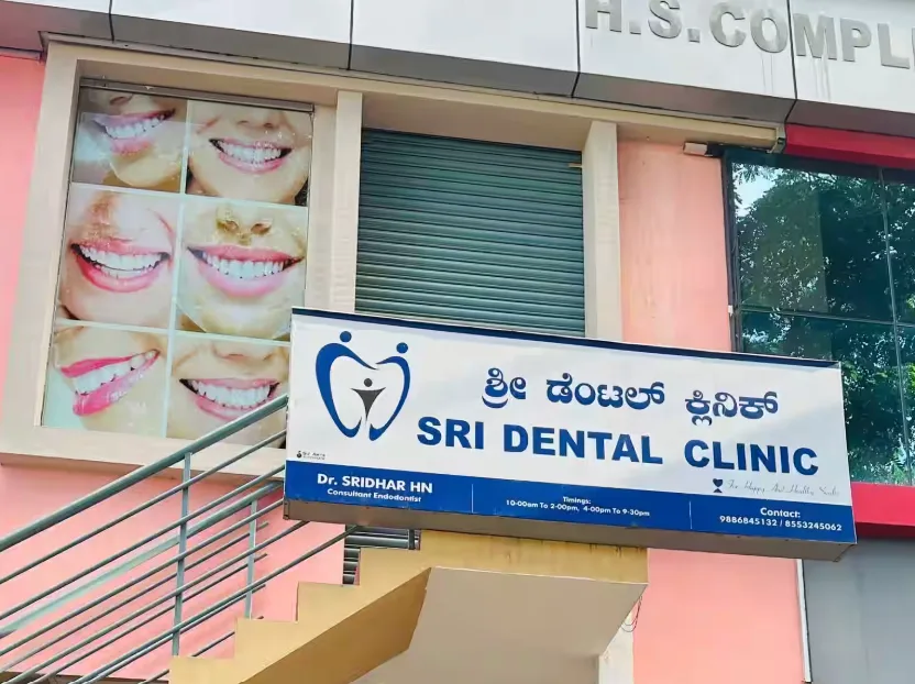 A sign for "SRI DENTAL CLINIC" in Jayalakshmipuram, Mysore is shown. The photo can be used by Aspire Digital Solutions to show they can help healthcare businesses with their marketing.