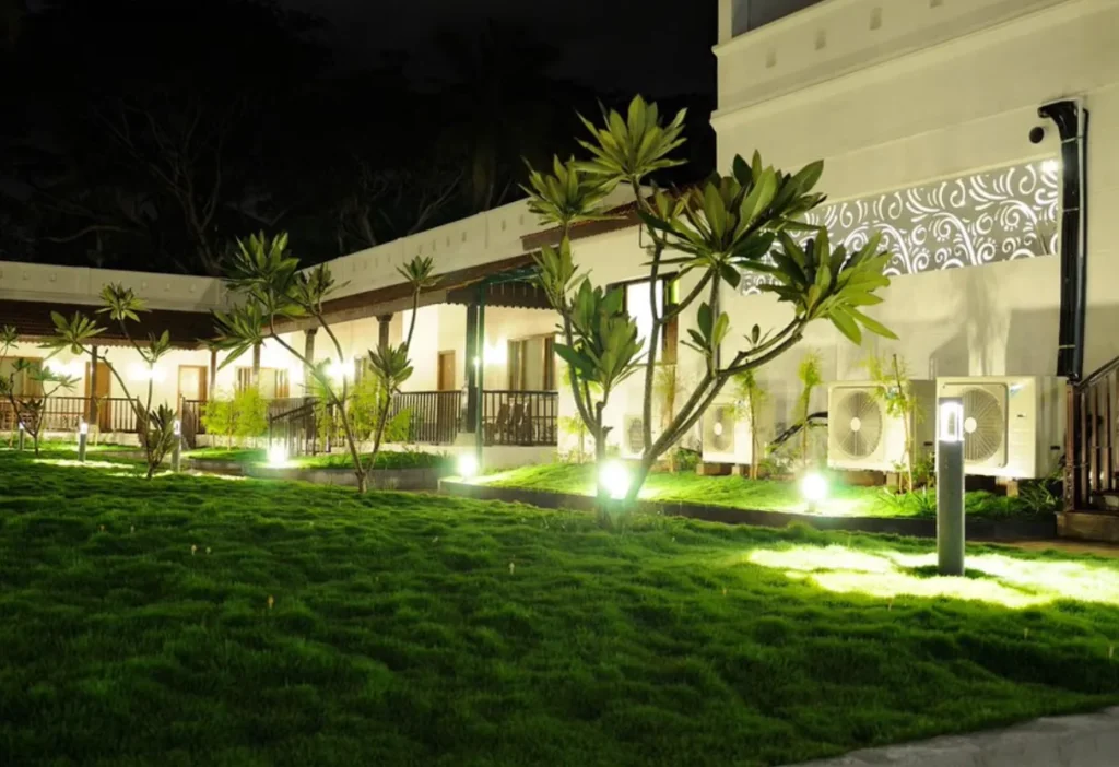 A beautiful, small resort near Chamundi Hills, Mysore, is lit up at night. This image can be used by Aspire Digital Solutions to show how they help market hotels and resorts.