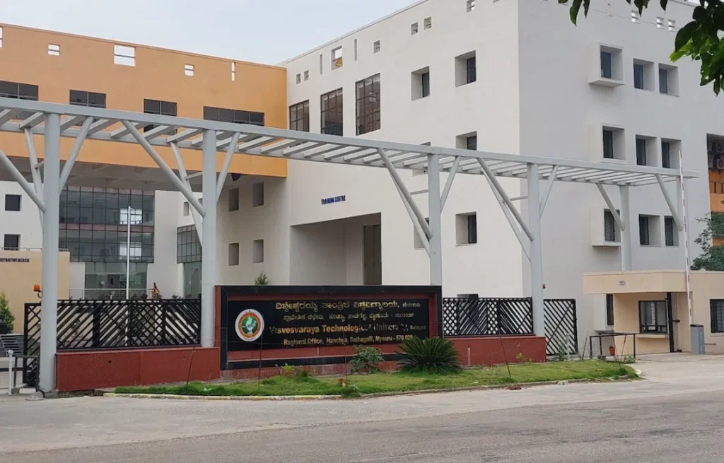 A large, multi-story building, which could serve as a venue for an online course creator in JP Nagar, Bangalore, features a sign for "Visvesvaraya Technological University." The image's clean lines and modern architecture suggest a professional digital rendering, possibly created by Aspire Digital Solutions.